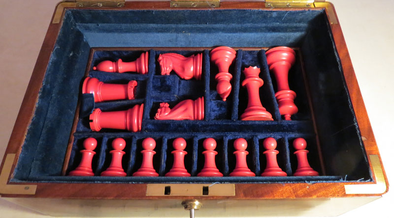 Red Staunton Chessmen in their taylor made blue plush velvet tray