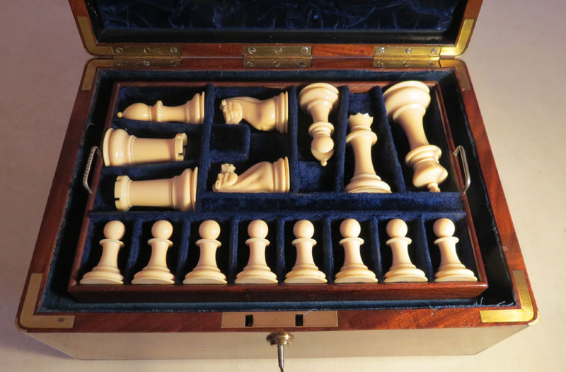 White ivory Staunton chessmen in specially made blue velvet plush lined tray