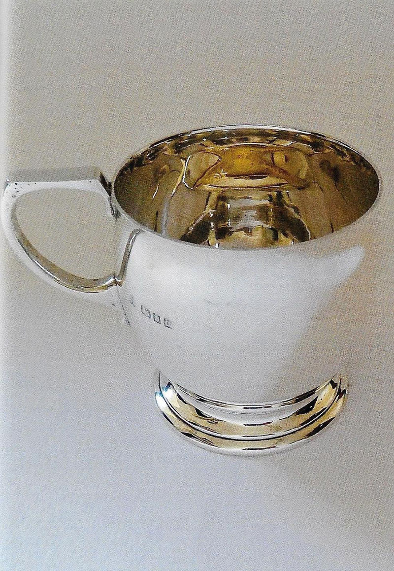 Silver George V mug of bulbous form applied with gold fish by Wakeley & Wheeler  1929