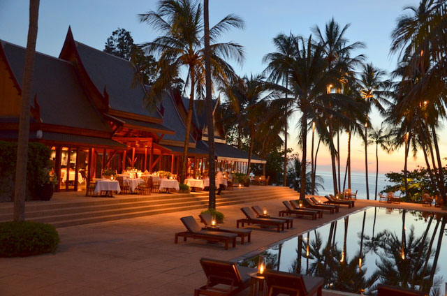 The Amanpuri - the pool and restaurant at dusk